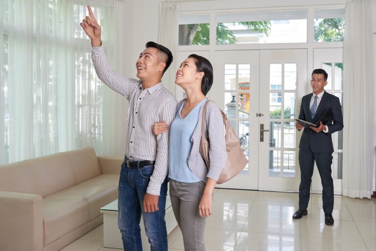 Excited,Young,Asian,Couple,Visiting,House,For,Sale